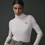 Col roulé en 100% laine écru pour femme, élégant et chaleureux.