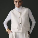 Gilet blanc pour femme en 100% laine, élégant et chaleureux.